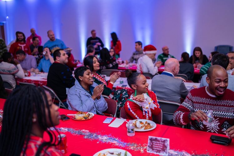 LifeStation employees enjoying a festive holiday gathering, highlighting the company's emphasis on community and celebration within its work culture