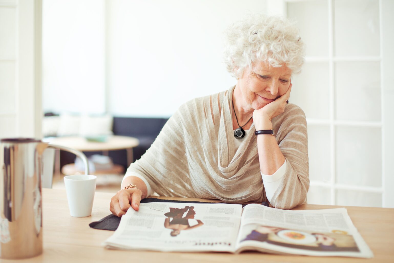 Senior woman reading at the table