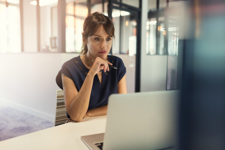 Woman sitting at computer in office