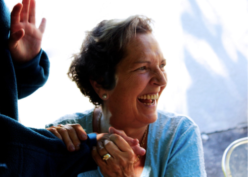 a happy senior woman that may need a senior caretaker