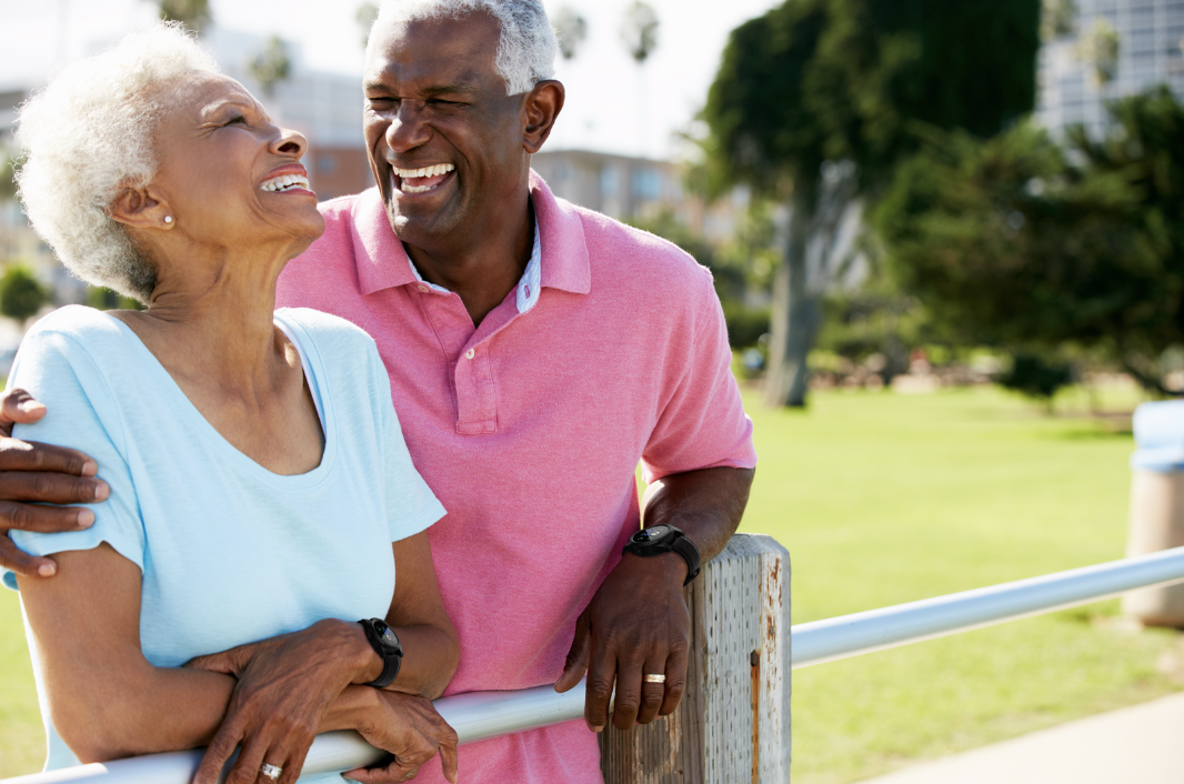 two seniors laughing and having a good time together