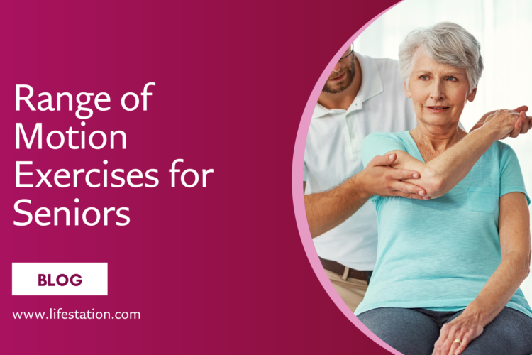 An elderly woman with short white hair, wearing a light blue t-shirt, is participating in a physical therapy session. A male therapist in a white polo shirt is helping her stretch her arm. They are indoors in a bright, clinical setting with natural light.