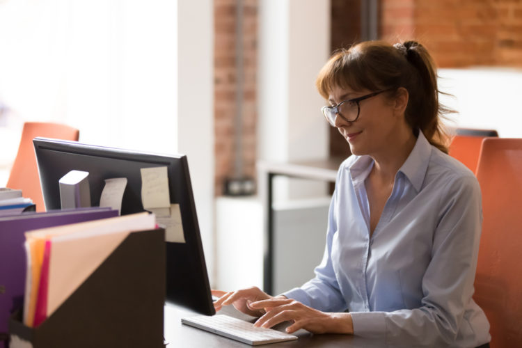 Woman working at computer in office