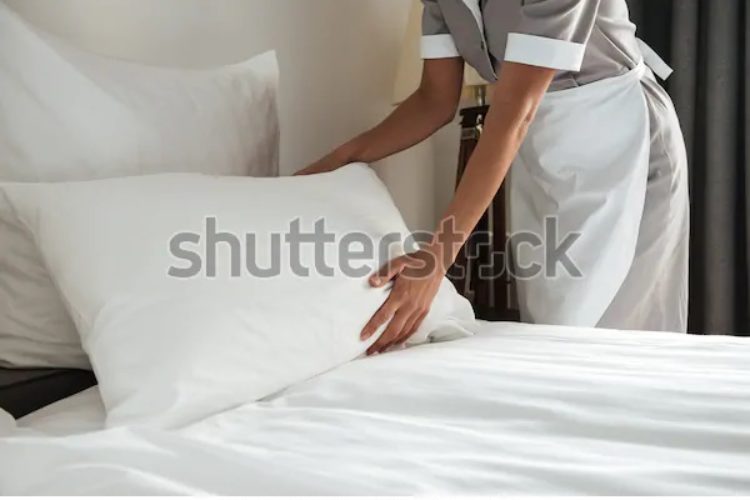 https://www.shutterstock.com/image-photo/cropped-image-female-chambermaid-making-bed-654521482