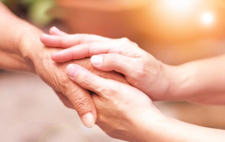 Picture of two people holding hands