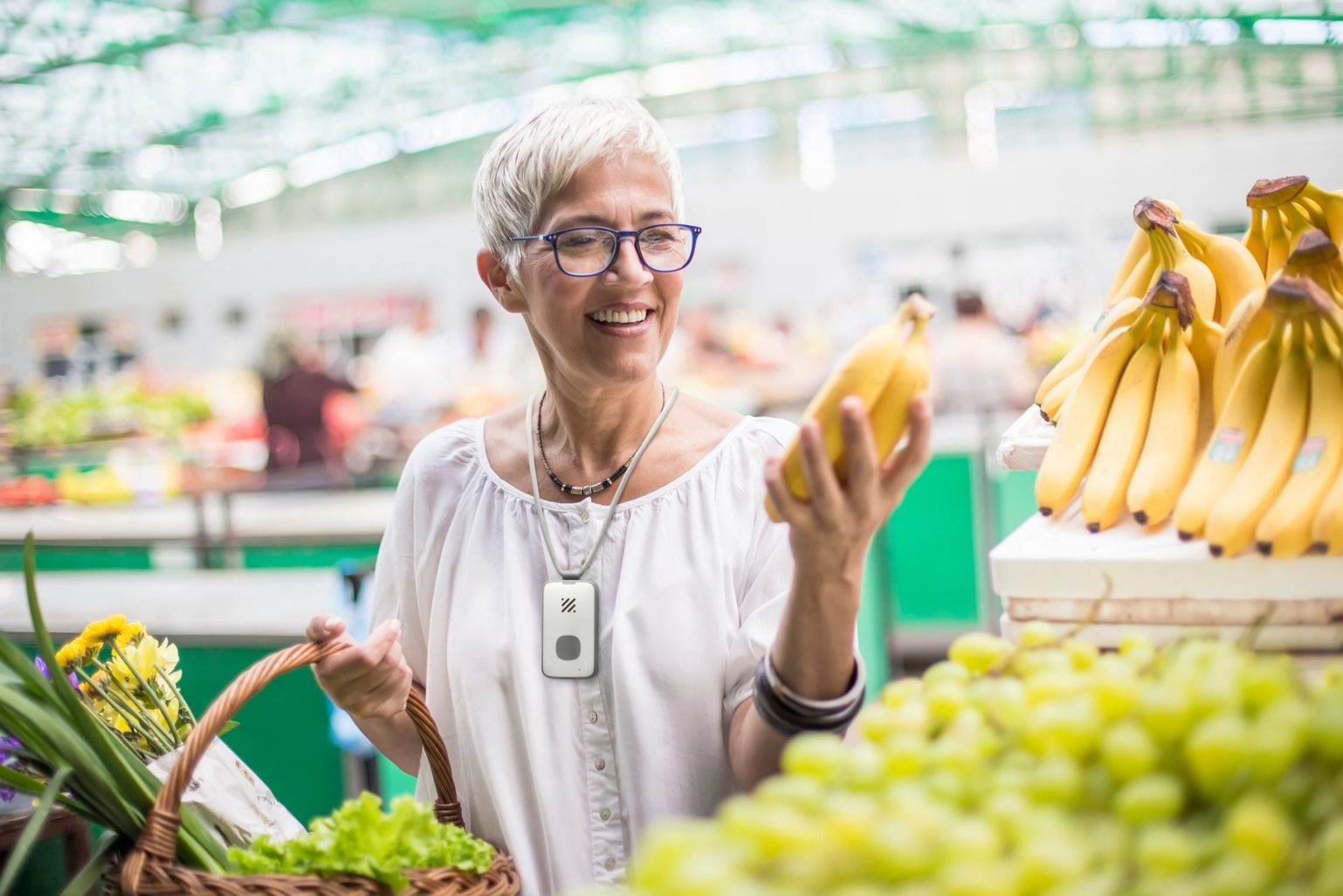 Woman buying bananas in store