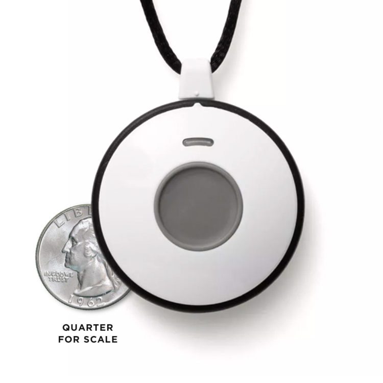 Wireless pendant shown next to quarter