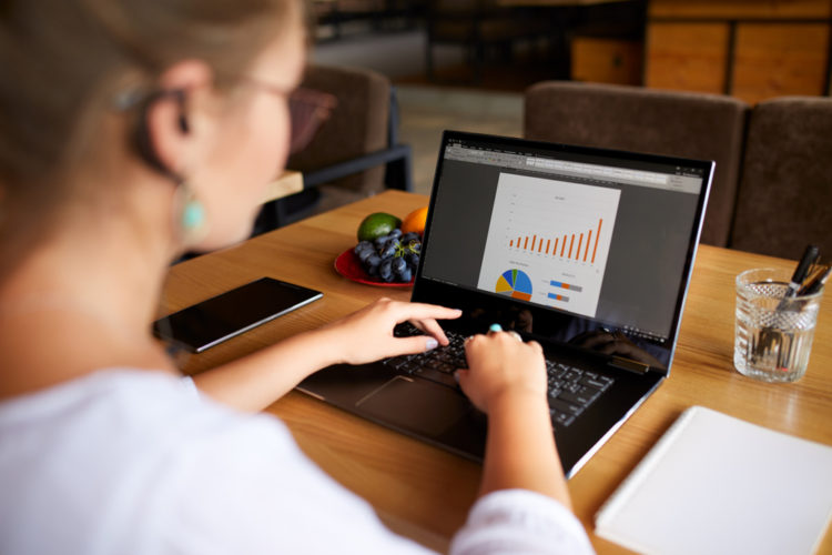 Woman working on a presentation on her laptop