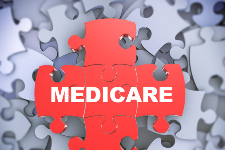 Puzzle pieces with medicare written in the center