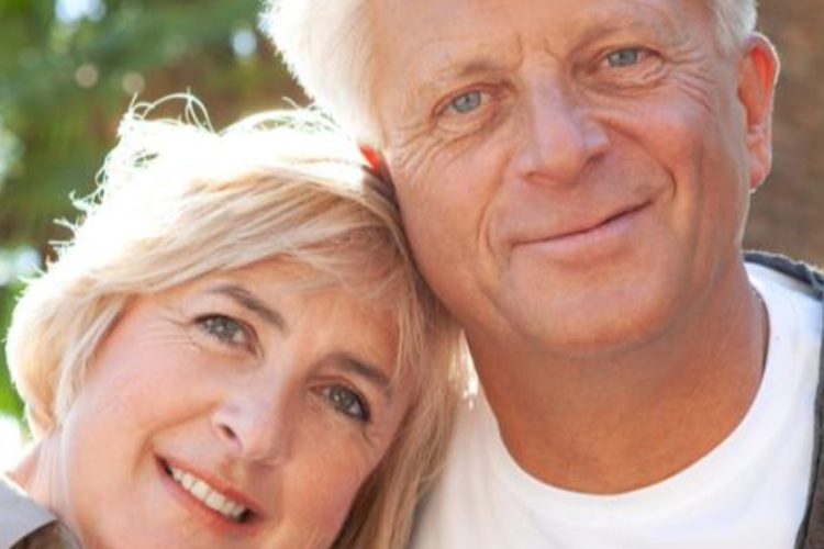 Elderly couple hugging